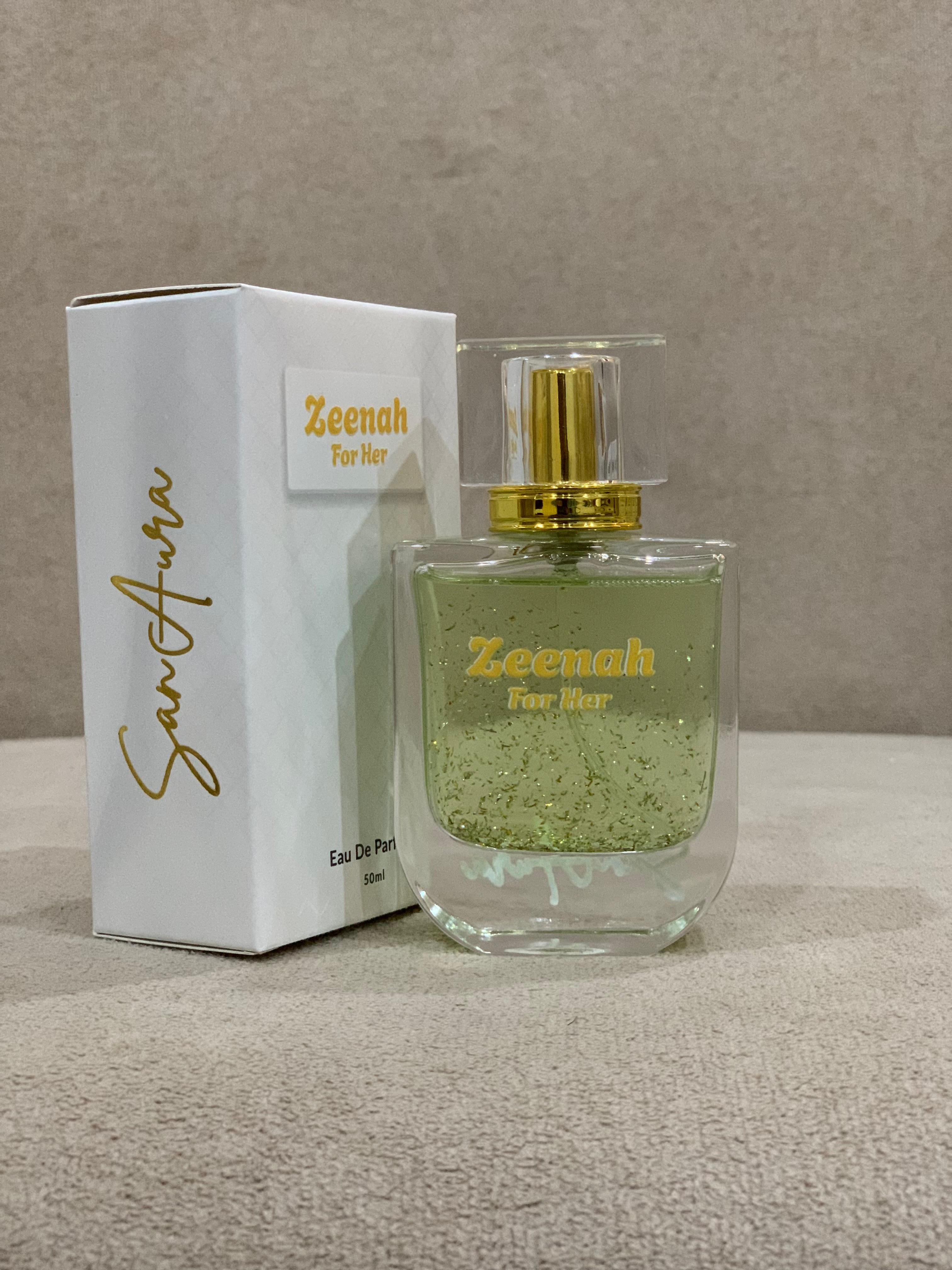 Zeenah perfume bottle and packaging on a neutral background